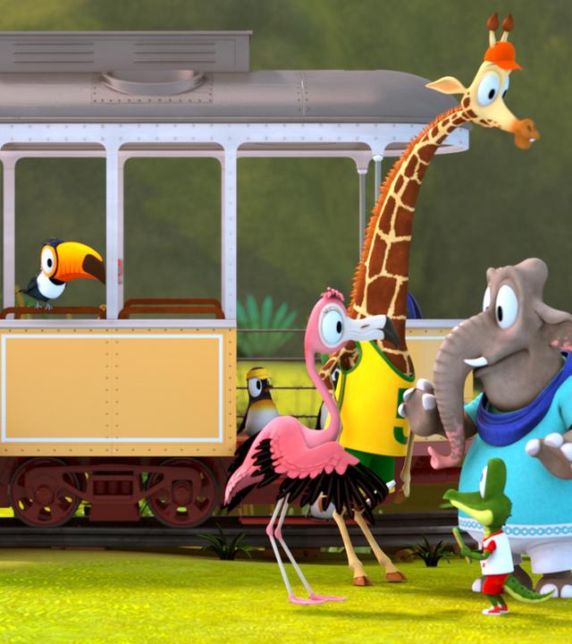Die Zootiere stehen vor einem Bahnwaggon. Flora spricht mit Zacki, Bruno und Frau Emily.
