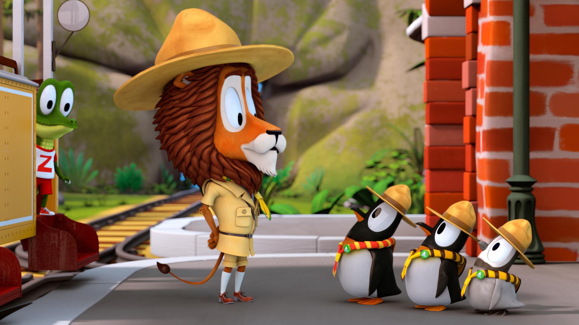 Lionel (Mitte) steht vor den hintereinander aufgereiheten Pinguinen. Zacki (links) beobachtet sie aus der Bahn heraus.