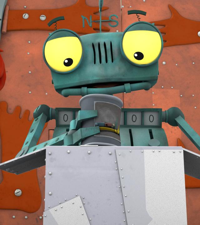 Rösti holt die Dose mit der Asche eines Verwandten aus einem Karton und schaut diese an. Bö steht daneben und schaut sie ebenfalls erwartungsvoll an.