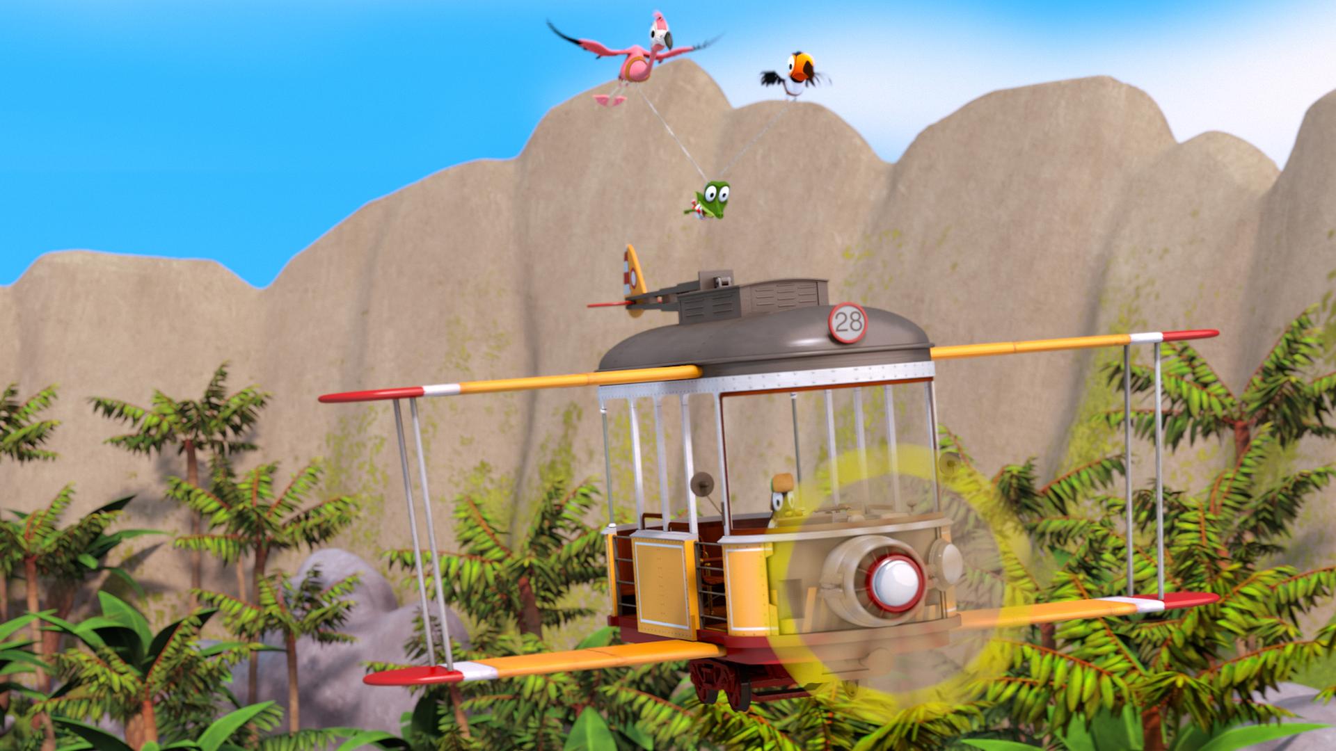 Vor einer Hügelkette fliegt ein Doppeldecker. Darüber fliegen ein Flamingo und ein Tukan, die ein Seil im Schnabel haben. Daran hängt zwischen ihnen Krokodil Zacki.