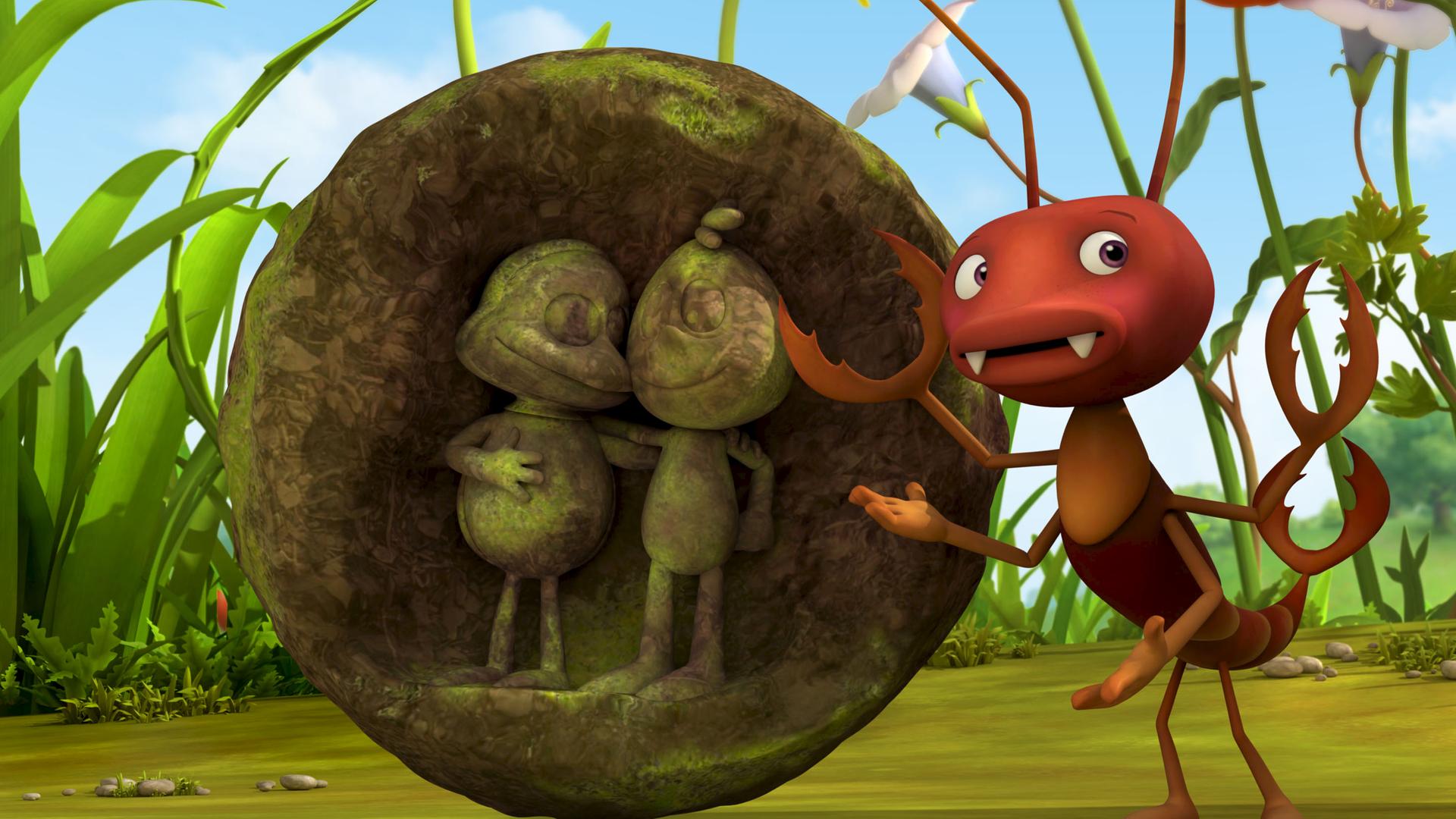 Ameise Oswalt und eine Statue mit der Abbildung von zwei ameisenähnlichen Figuren.