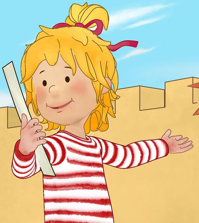 Conni hält ein Papier in der Hand und zeigt auf die Burg. Im Hintergrund steht ein Ritter und hält eine Flagge.