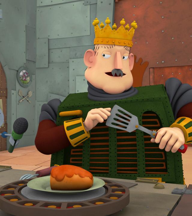 Der König wird während des Essens vor laufender Kamera interviewed. 