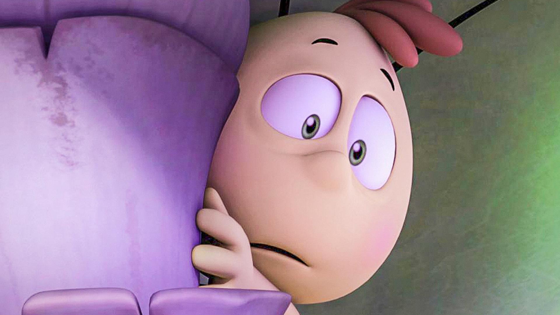 Willi schaut ängstlich hinter einem Blatt hervor. Er versteckt sich und zögert hervorzukommen.