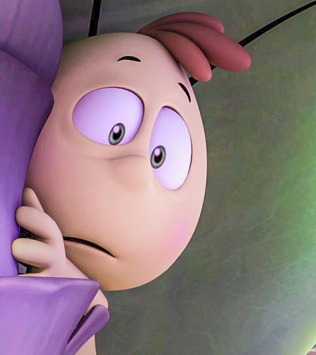 Willi schaut ängstlich hinter einem Blatt hervor. Er versteckt sich und zögert hervorzukommen.