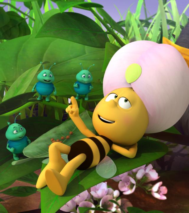 Willi, König der Blattläuse lässt sich von den Blattläusen wie ein König verwöhnen. Er liegt mit erhobenen Finger auf einem Blatt und gibt Anweisungen.