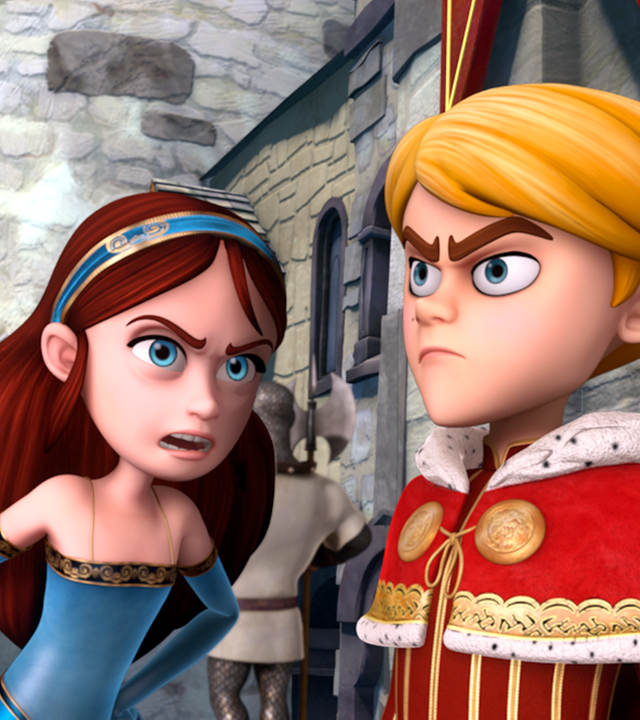 Lady Marian und Prinz John streiten sich. Marian stemmt ihre linke Hand in die Hüfte und beugt sich zu John vor.