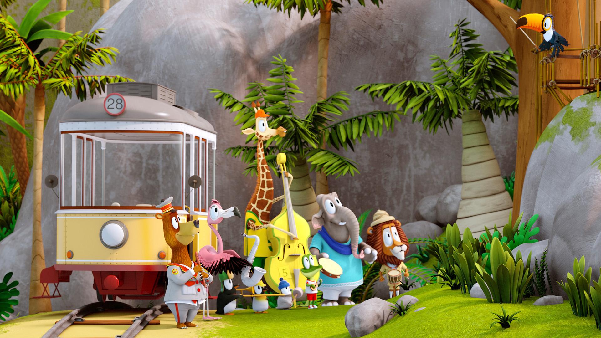In einer tropischen Landschaft verläuft ein Schienenstrang, darauf steht eine leere Straßenbahn. Vor der Bahn steht eine Gruppe Tiere mit Musikinstrumenten. Oben im Baum sitzt Tukan Toni mit einem Dirigentenstab im Schnabel.