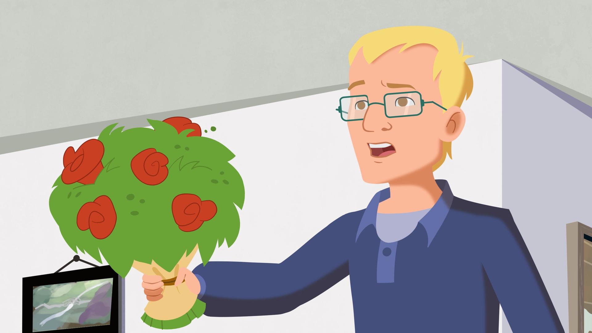 Taras Papa mit einem Blumenstrauß in der Hand.
