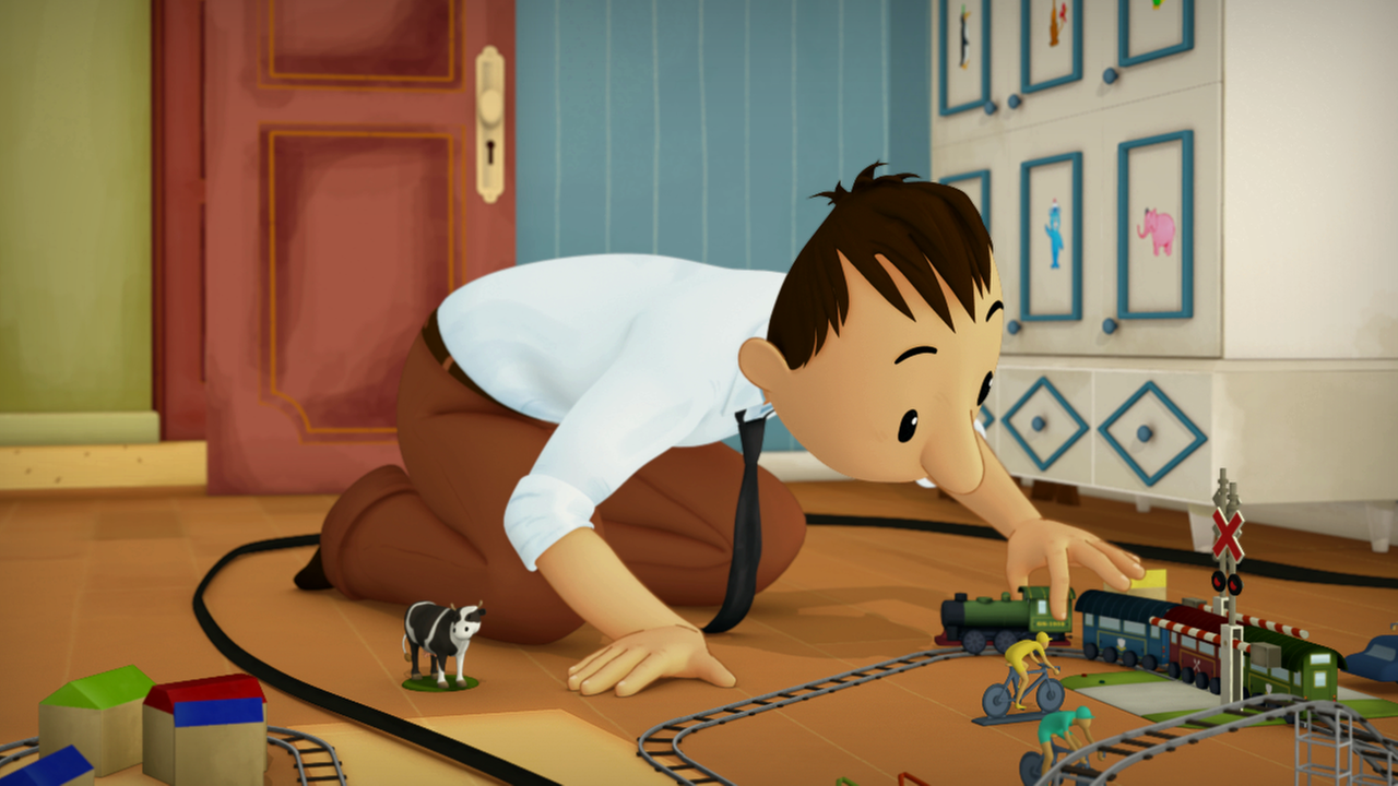 Papa Nick hantiert mit der Spielzeugeisenbahn.