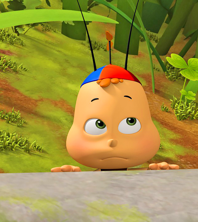 Zwei kleine Bienen schauen hinter einer Mauer hervor. Im Hintergrund sieht man ein Bienenmädchen.