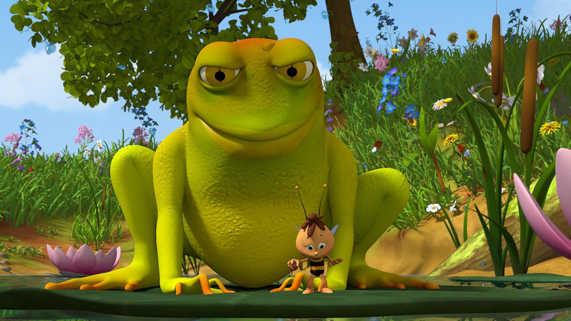 Willi steht auf einer Seerose. Hinter ihm lauert ein sehr großer Frosch.