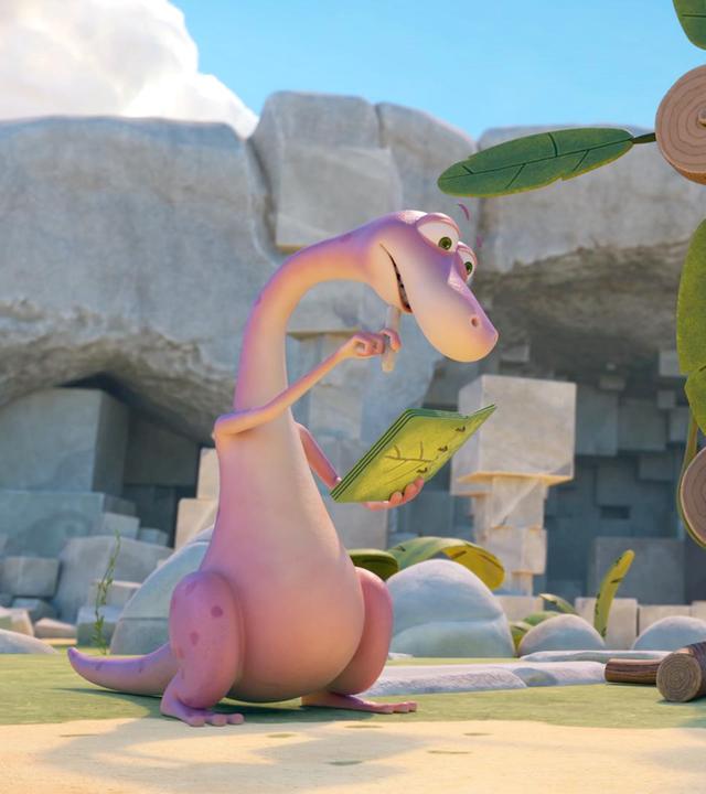 Der rosafarbene Dinosaurier Minus Drei studiert eine grüne Bedienungsanleitung. Neben ihm steht seine selbstgebaute Erfindung - eine Art Ventilator mit Kurbelantrieb. Seine Freundin, die kleine Menschin Lucy, schaut ihm interessiert zu.