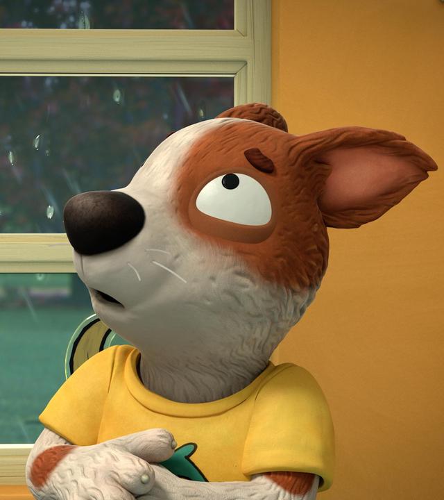 Der Hund Zac fürchtet sich. Er hat seine Ohren nach hinten gelegt und schaut sehr verängstigt aus. Der Blick aus dem Fenster zeigt dunkle Wolken und starker Regen, der gegen die Scheibe prasselt. Auf dem Fenster ist ein Aufkleber in Form eines Huhns geklebt.