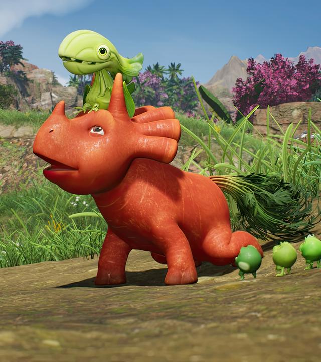 Vor einer Berglandschaft: Ginger, das orangefarbene Karotten-Dinosaurier-Mädchen, trägt auf ihrem Kopf das Baby eines Pakchoidactylus. Ginger versucht, den grünen Baby-Dino zum Losfliegen zu bewegen. Die drei Erbs-Rexe schauen dabei zu.