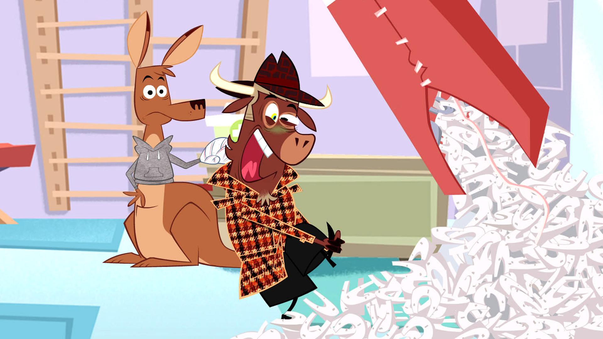 Sherlock Yack untersucht den Boxsack. Das Känguru und Hermione stehen daneben. Der Boxsack ist aufgerissen, Hufeisen quillen daraus hervor. Sherlock Yack hält sich den Fuß fest.