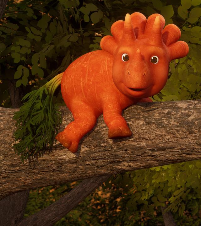 Ginger liegt mit dem Bauch auf einem dicken Ast in einem hohen Baum und hält sich mit ihren vier Beinen fest. Das Trikarottops-Mädchen ist so hoch geklettert und kommt nicht mehr alleine herunter.