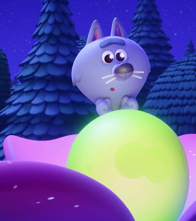 Der lilafarbene Wolf Wilf steht vor einer grün-gelb leuchtenden Kugel inmitten einer rosa Blume. Es ist Nacht. Wilf macht eine entzückte Geste, so als wolle er die leuchtende Kugel gleich umarmen.