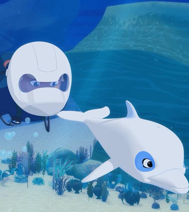 Yann taucht in Taucherausrüstung, aber mit einem speziellen weißen Helm. Vor ihm schwimmt Zoom.