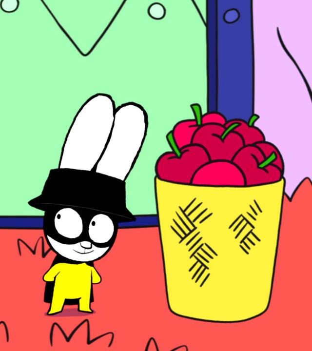 Superhase und Captain Hase stehen mit neugierigem Blick neben einem großen Korb mit Äpfeln. Beide schauen sich freudig an.