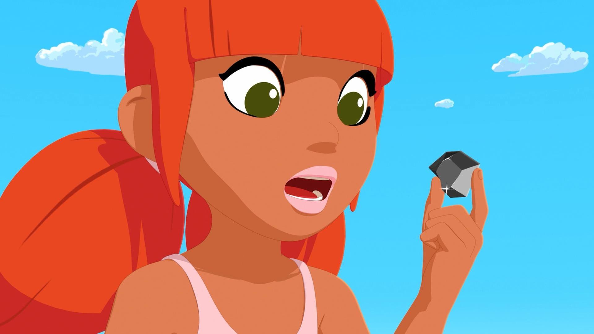 Marina hält einen schwarzen Diamanten in der Hand und schaut ihn sich genau an. 