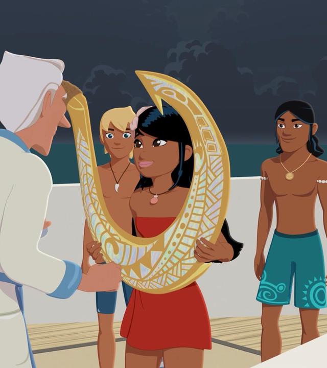 Van Krook steht an Deck eines Schiffes vor der erfreut schauenden Timeti, die einen großen goldenen Haken mit ornamentalen Verzierungen in beiden Händen hält. Van Krook zeigt mit dem rechten Zeigefinger auf den Haken. Hinter Timeti stehen Yann und Auru und schauen erstaunt zu Van Krook.