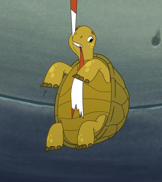 Die grüne Schildkröte Törtel beißt in ein rot-weißes Absperrband und hängt daran in der Luft. Um ihn herum ist es grau und dunkler, wie in einem Tunnel.