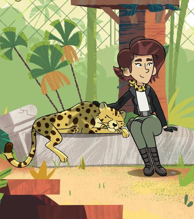 In einem schönen Raubtiergehege sitzt eine Frau auf einem großen Stein. Sie streichelt eine schlafende Gepardin. Im Hintergrund sieht man zwei Autoreifen an einem Seil und zwei Liegevorrichtungen im Baum, die durch eine kleine Hängeleiter verbunden sind. Eine Felsentreppe führt in eine höhere Etage.