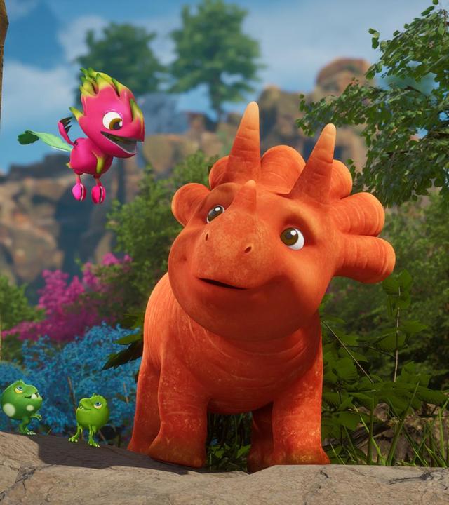 Neben Ginger, dem Trikarottops-Mädchen, schwebt ein Drachenfruchtfliegus, Auch die drei Erbs-Rexe stehen neben Ginger und schauen ebenfalls hinauf zum Drachenfruchtfliegus. (Ein Drachenfruchtfliegus ist ein Fantasie-Wesen. Es ist ein Vogel und sieht aus wie eine bunte Drachenfrucht.) Im Hintergrund sehen wir eine felsige Landschaft und einige Bäume und Sträucher.