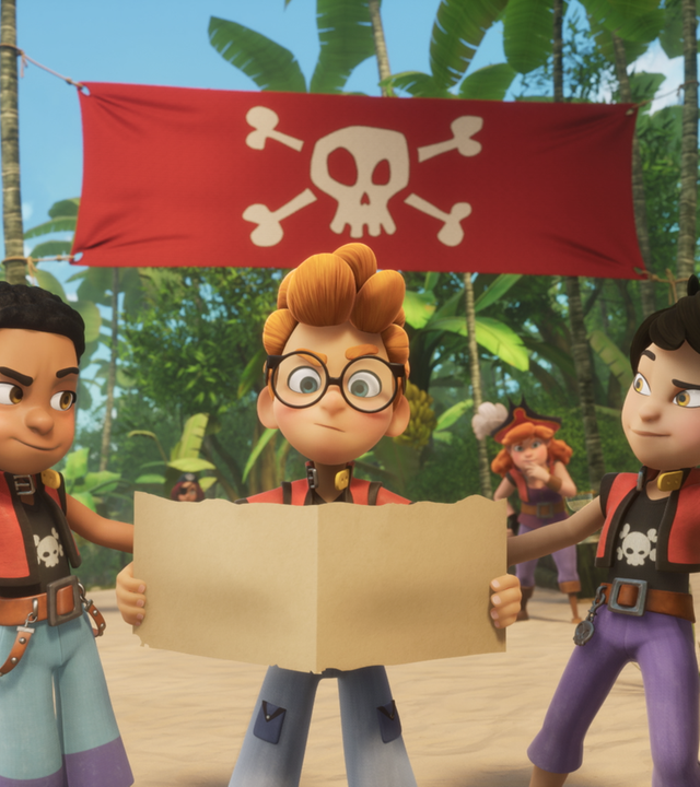 Am Strand steht Alexander zwischen Finn und Zoe. Alle drei halten jeweils ein Stück einer großen Schatzkarte in den Händen.