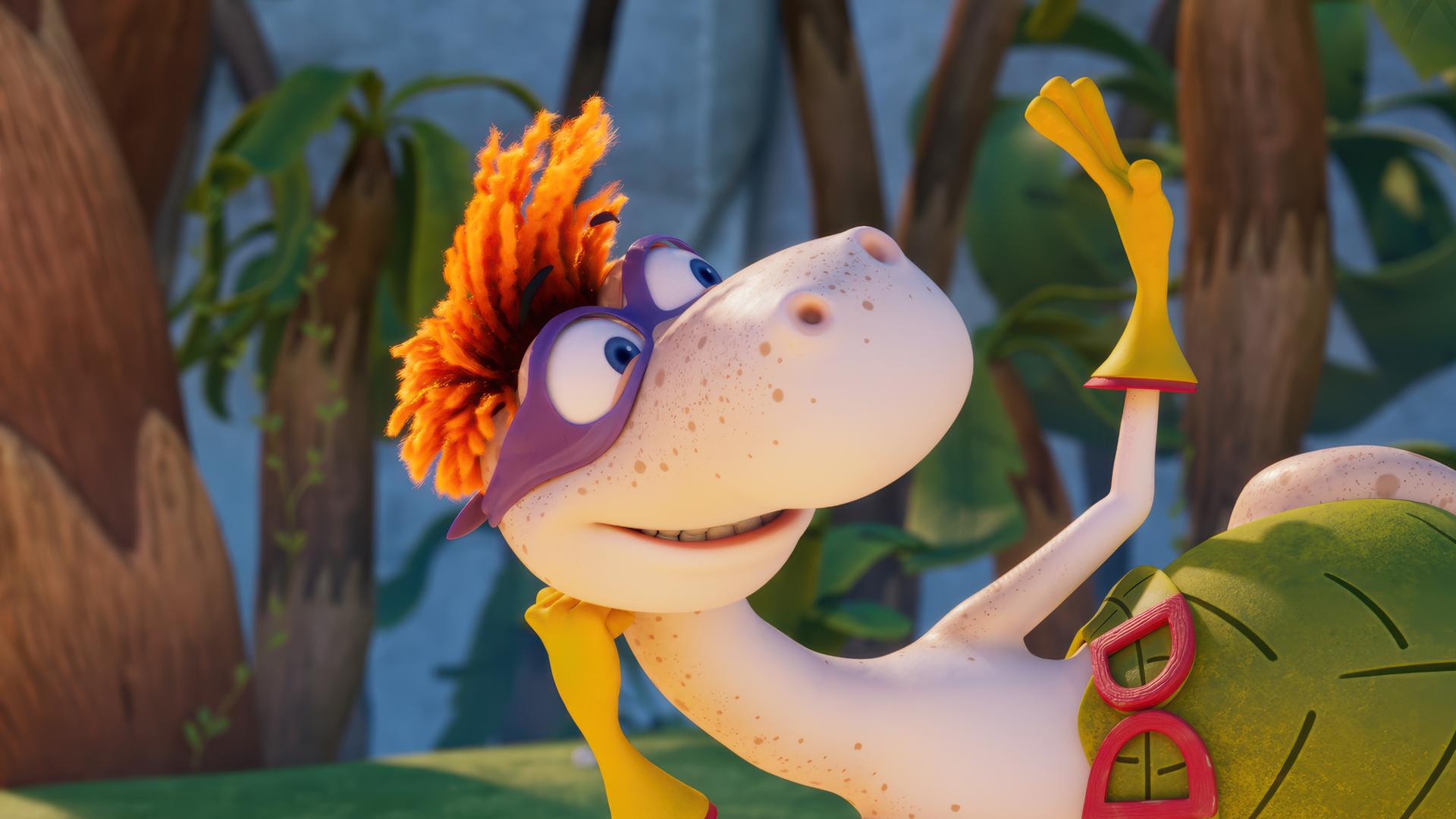 Der Dinosaurier Flint mit den orangefarbenen Wollhaaren ist als Super-Flint verkleidet. Er trägt eine lilafarbene Augenmaske, gelbe Handschuhe und einen großen Gürtel. Er reckt die Fäuste nach oben. Im Hintergrund stehen Minus Drei und Lucy und feuern Super-Flint an.