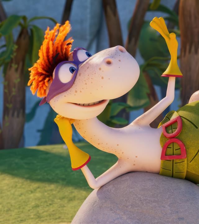 Der Dinosaurier Flint mit den orangefarbenen Wollhaaren ist als Super-Flint verkleidet. Er trägt eine lilafarbene Augenmaske, gelbe Handschuhe und einen großen Gürtel. Er reckt die Fäuste nach oben. Im Hintergrund stehen Minus Drei und Lucy und feuern Super-Flint an.