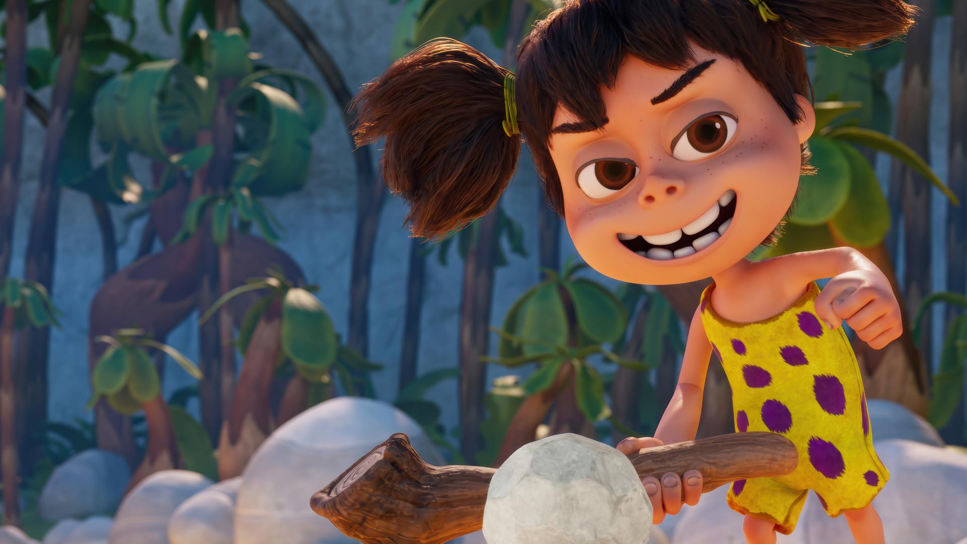 Das Steinzeitmädchen Lucy hält einen Stock wie einen Golfschläger in der Hand. Vor ihr liegt ein steinerner Golfball. Sie grinst, als würde sie den Ball mit einem Schlag einlochen.