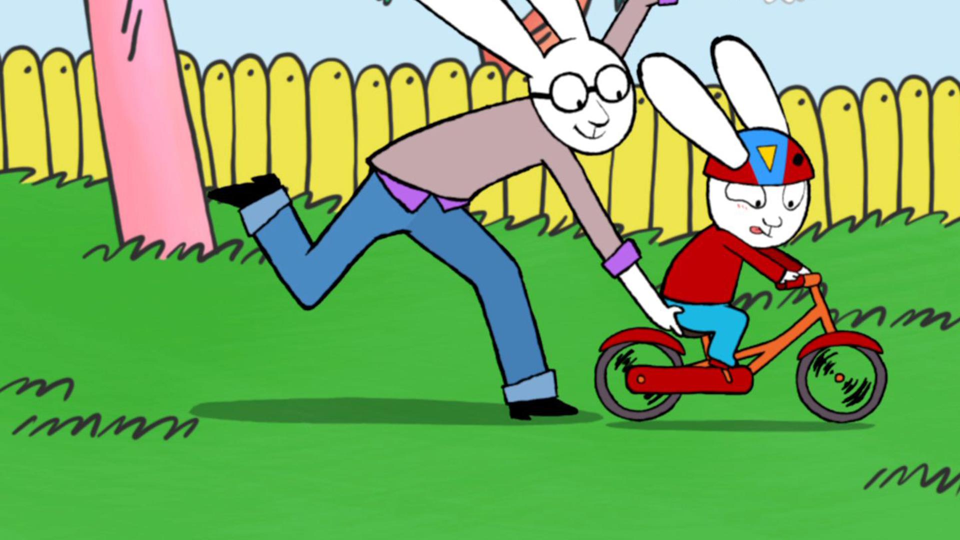 Simon, mit einem Fahrradhelm auf dem Kopf, fährt hastig mit seinem Fahrrad durch den Garten. Papa hält das Fahrrad am Sitz fest und läuft gemeinsam mit Simon durch den Garten.