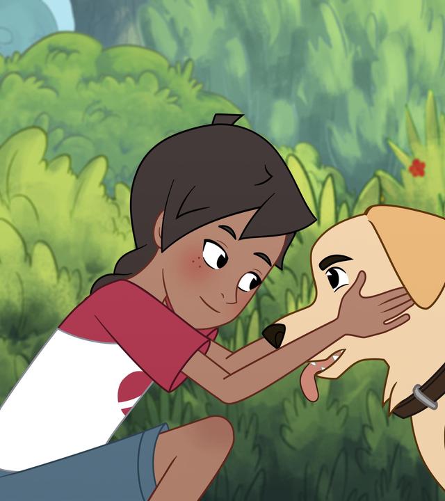 Josefine, ein Mädchen mit braunen Haaren, die zu einem Zopf geflochten sind, streichelt ihren großen Hund mit beigefarbenen Fell und braunen Halsband. Sie schauen einander an. Im Hintergrund sind Bäume und Hecken.