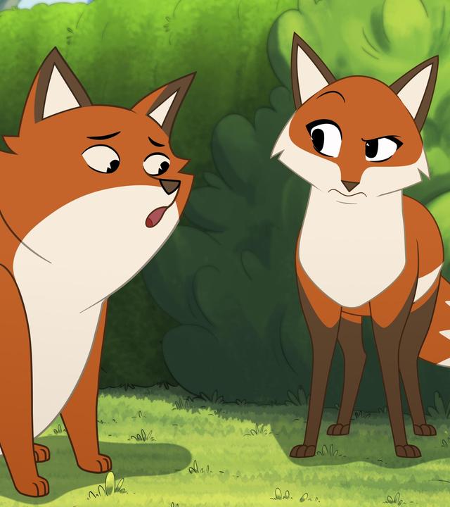 Vor einer grünen Hecke stehen die kleine Schildkröte Törtel und Füchsin Wendy. Sie beäugen den orangefarbenen Fuchs Iwo mit kritischem Blick. Dieser sitzt ihnen mit unsicherem Gesichtsausdruck gegenüber.