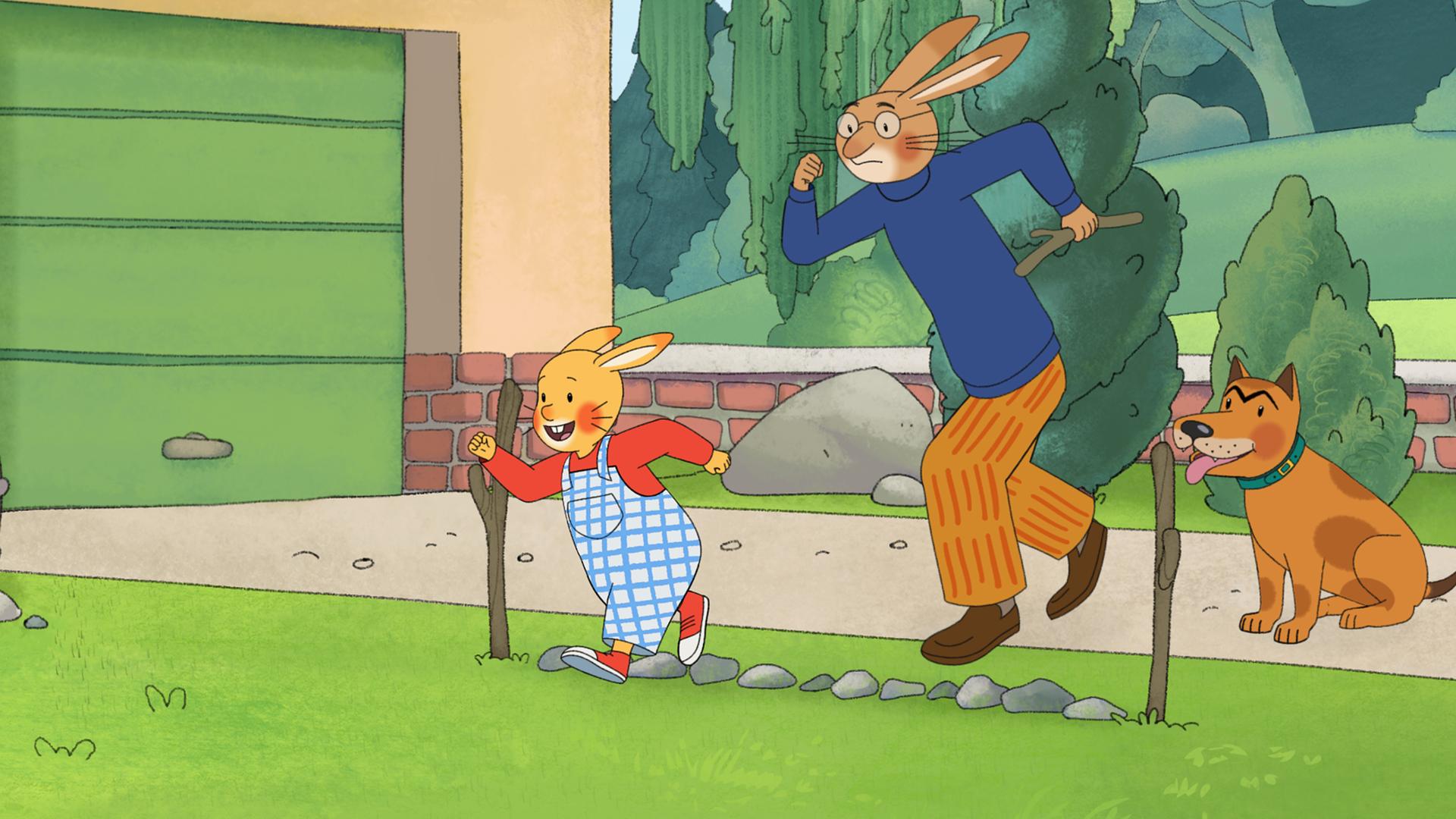 Karlchen und sein Vater stehen im Garten an einer Startlinie aus Steinen. Hinter ihnen sitzt Bello und wartet darauf, dass das Rennen beginnt. 