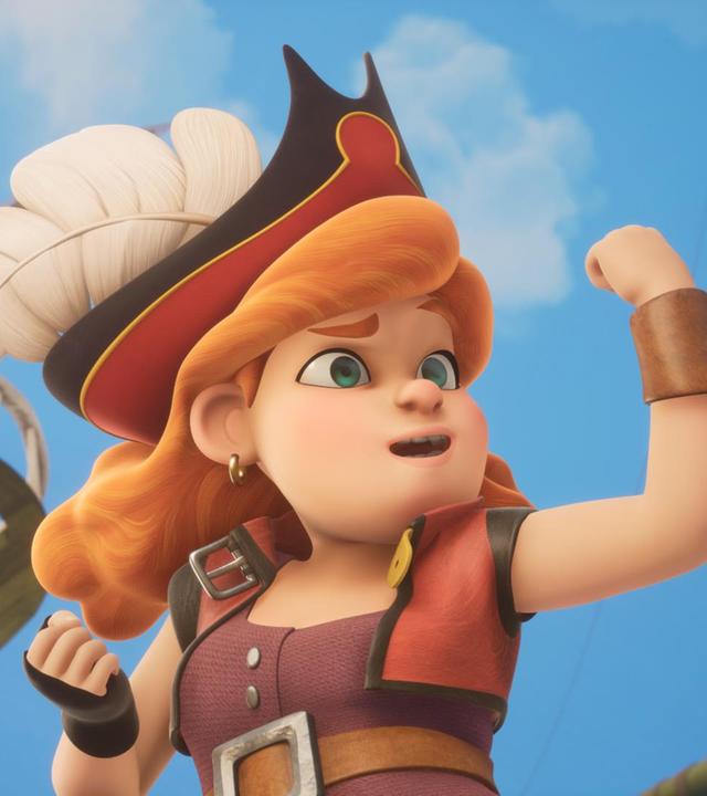 Käpt'n Charlotte Raubein, Lehrerin der Sardinen, hält die linke Faust erhoben wie in einer Siegerpose und schaut unerschrocken drein.