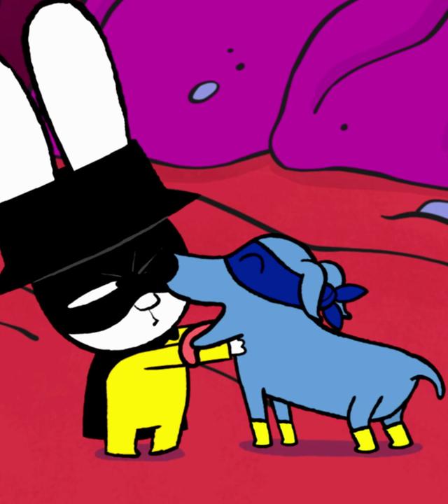 Super-Elvis begrüßt liebevoll sein geliebtes Herrchen Captain Hase und schleckt ihm durchs Gesicht.