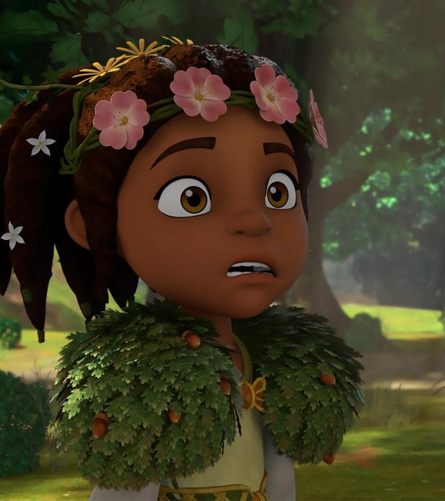 Die Druidin Katell steht vor einem Hirsch im Wald. Der Hirsch blickt sie an. Katell sieht entsetzt und alarmiert aus.