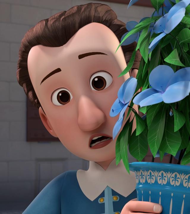 Gärtner Henri hält mit erschrockenem Blick einen blau-weißen Pflanztopf in seinen Händen, in der sich eine grüne Pflanze mit blauen Blüten befindet.