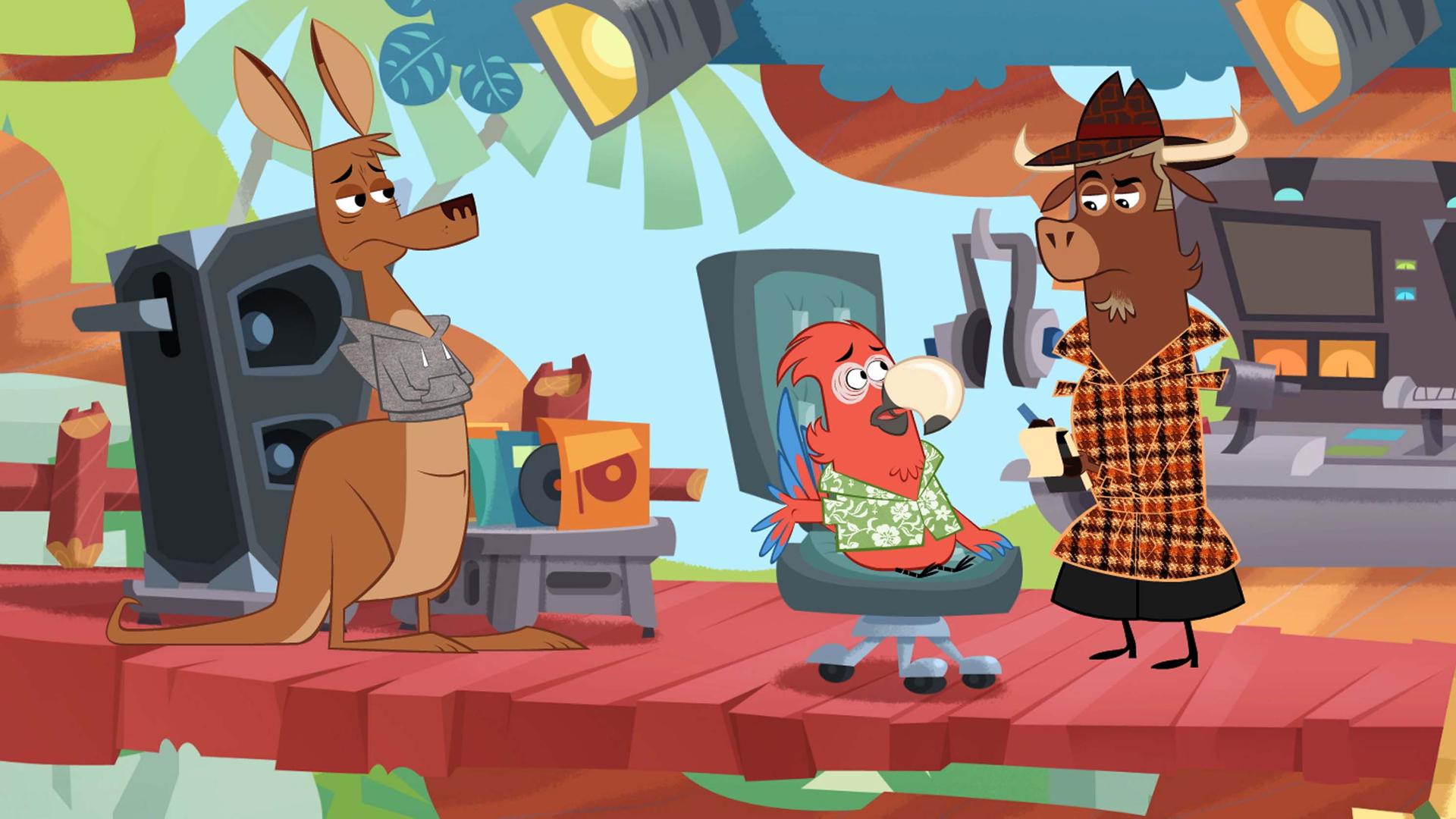 Sherlock Yack und Heißsporn Känguru verhören den Papagei im Sender. Er sitzt beängstigt auf einem Bürostuhl, während Sherlock Yack mit kritischem Blick Notizen in seinen Spiralblock macht.