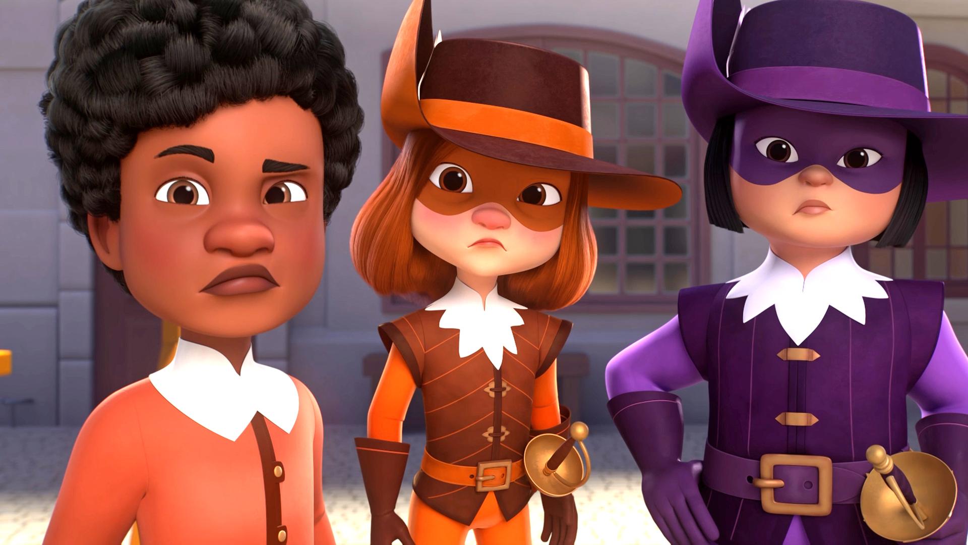 Alex, d'Artagnan und Porthos in Großaufnahme: sie stehen auf einem gepflasterten Hof und blicken ernst und etwas ungläubig die Zuschauer an.