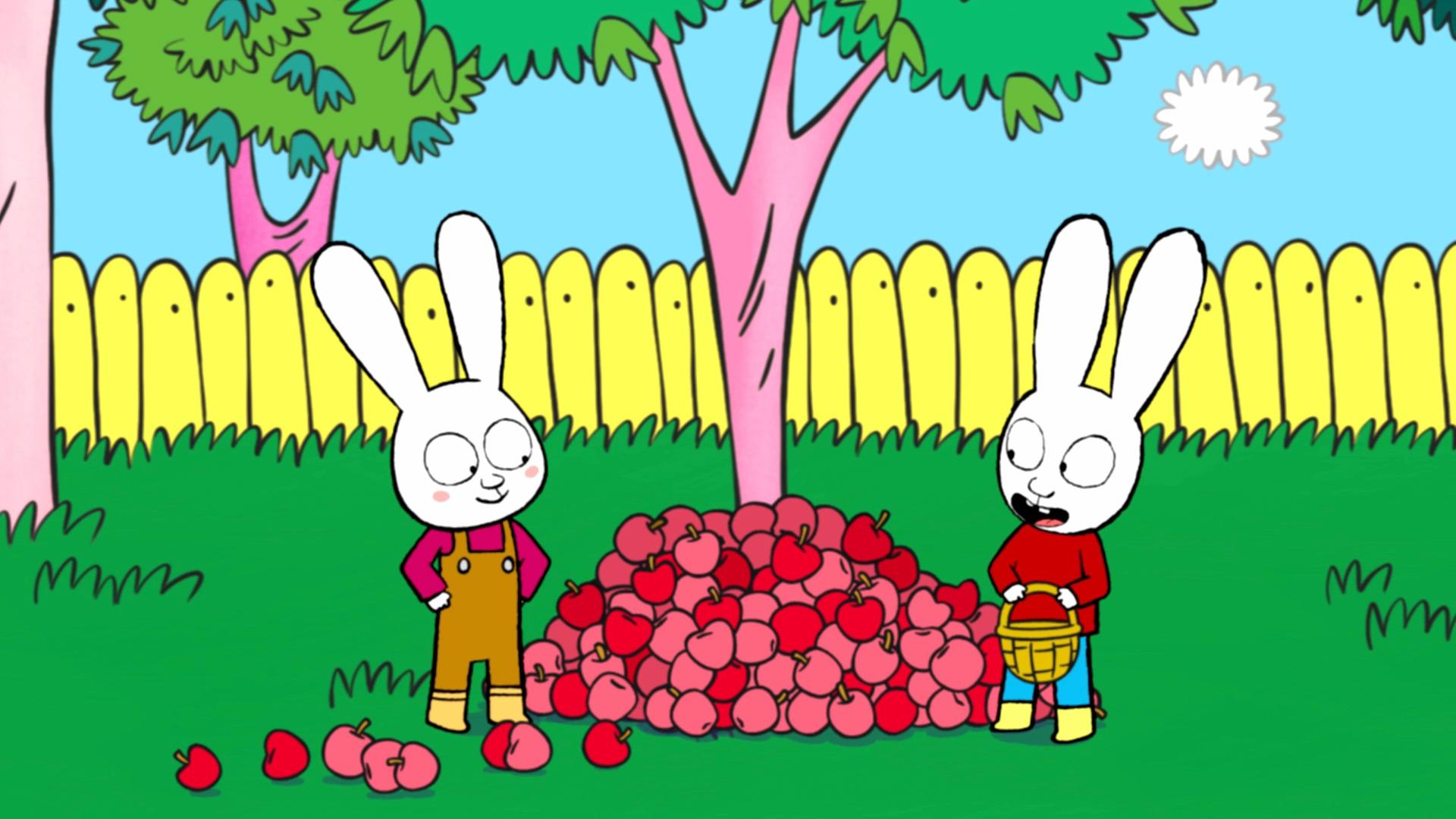 Simon steht mit Bauernjunge Boris vor einem Apfelbaum, unter dem ein großer Berg Äpfel liegt. Simon hält einen Korb in seinen Händen und schaut zu Boris herüber. Boris steht neben dem Apfelberg, hat seine Hände in die Hüften gestemmt und schaut freundlich zu Simon.