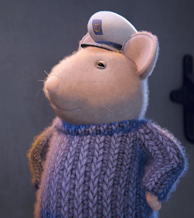 Sam trägt stolz die Seemannsmütze auf dem Kopf und grinst vor sich hin.