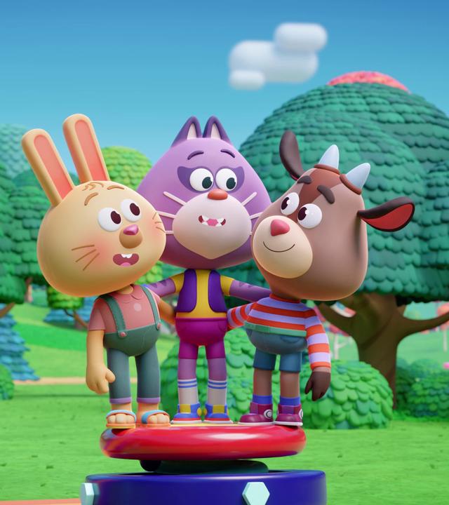 Auf einer Sprungfeder stehen das Hasenmädchen Rebecca, die Katze Holly und Kris, der Ziegenjunge. 