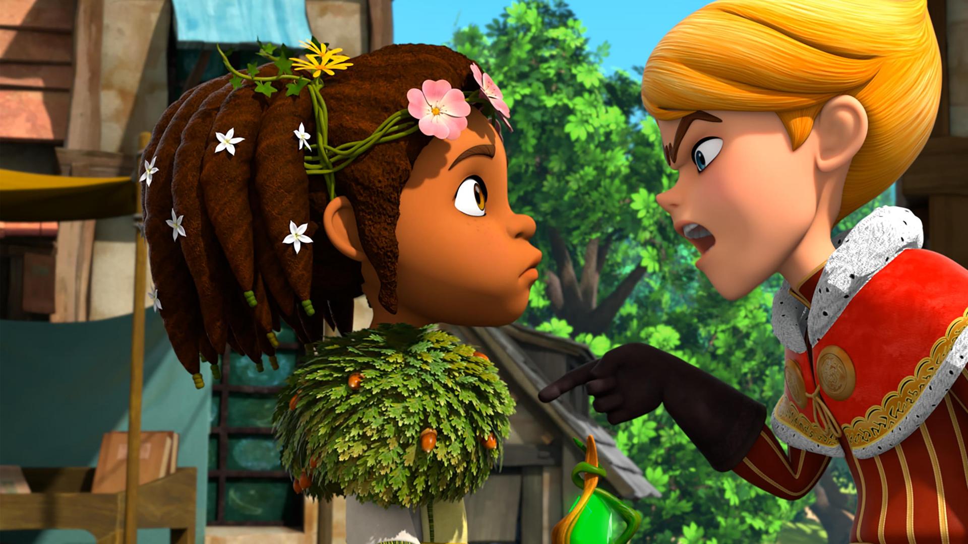 Auf dem Dorfplatz beugt sich Prinz John streitlustig zu Katell. Er hat seinen Finger anklagend auf sie gerichtet.