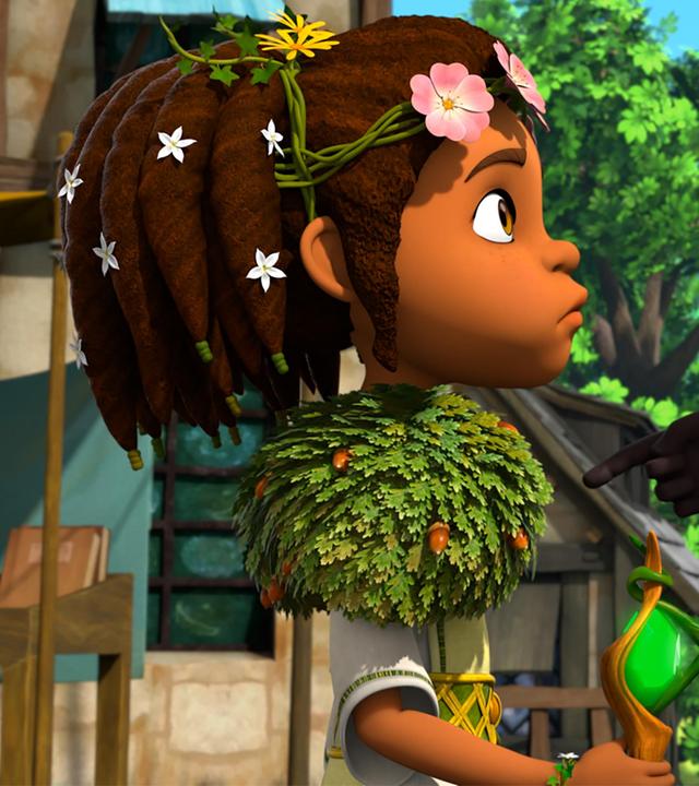 Auf dem Dorfplatz beugt sich Prinz John streitlustig zu Katell. Er hat seinen Finger anklagend auf sie gerichtet.