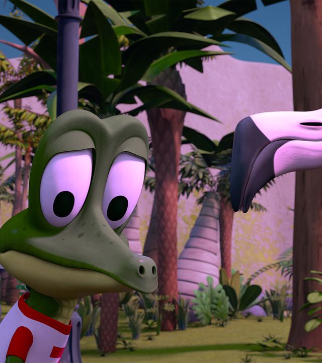 Krokodil Zacki schaut eingeschüchtert auf den Boden, während Flamingo Flora ihn aufmunternd anschaut.