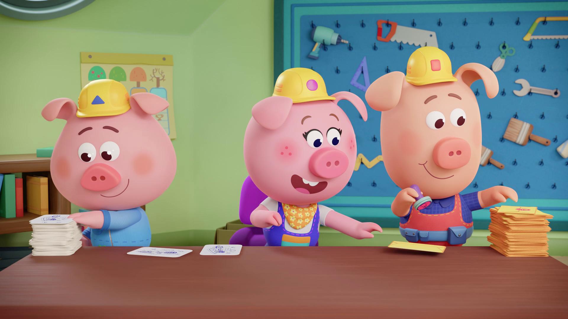 Die Werkel-Ferkel fertigen in ihrer Werkstatt Einladungen an. Charly macht die Karte, Cornelia schnappt sich einen gelben Umschlag und Caesar macht noch den Werkel-Ferkel-Stempel darauf. 